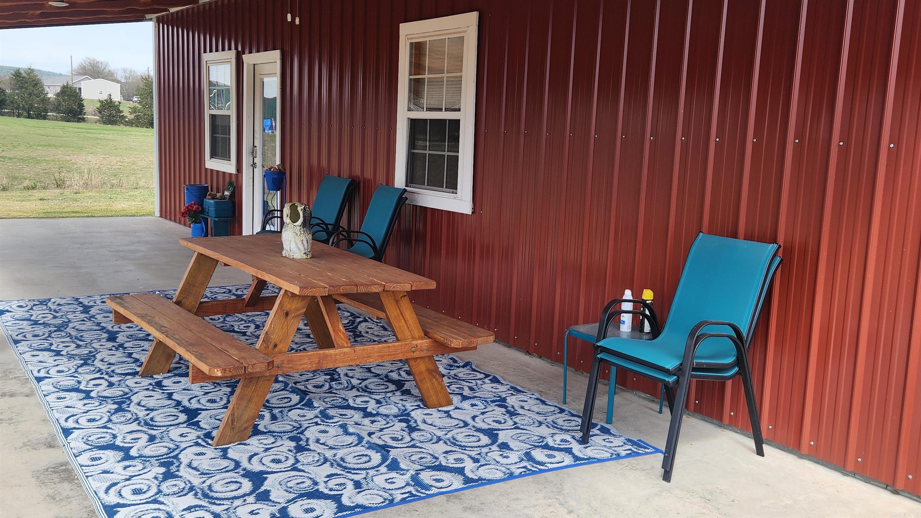 Built in 2021, this 1120 sq ft cabin is the perfect weekend getaway place. The metal building is 28x40 with two 12x40 covered porches. Spray insulation cover the ceilings for added protection. 12x20 boat shed is also a feature. All of this sets on 3.9 acres with a creek running along the south border. Nice mountain views. Well and septic. Inside features a large primary bedroom and walk-in closet. Guest bedroom features 4 built-in bunk beds. On-demand water heater for your endless supply of hot water. Comes mostly furnished. The rough-sawn lumber definitely gives it a cabin feel. Currently used as a vacation rental.