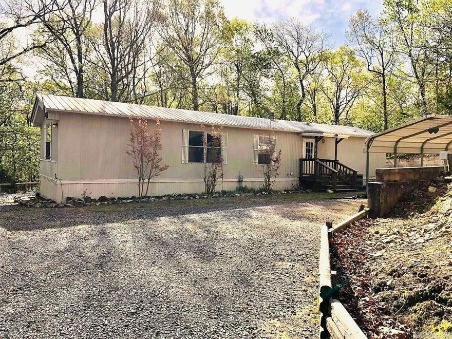 Perfect location for your new residence or rental property! This 1.4 acre property features a move-in ready, FULLY FURNISHED 2bed/2bath mobile home with a beautiful back deck that overlooks a wet weather creek and woods full of wildlife! This home has been very well maintained! The landscaping was planned out with low maintenance in mind (gravel yard, stone line paths, and a decorative pond in the back). Whether you are looking for a quiet place to live or a weekend get away, this place is for you! There is plenty of parking for trailers and an electric hookup for a RV and a separate hookup for a generator. It is a few minutes to town and ATV trails are just a short ride down the road! You don't want to miss out on this one of kind property at an affordable price!