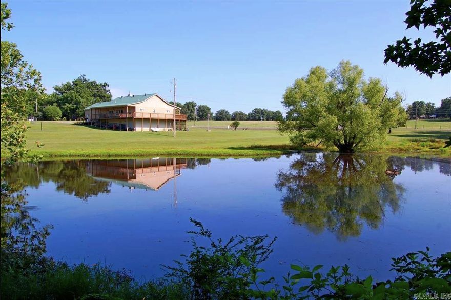 Amazing property! 8 acres with a pond and you can enjoy watching the wildlife from the covered porches. Home on the property features large spacious rooms. Under the home you will find a workshop and a dry storm shelter. There is a whole home propane generator. The entire property is fenced land and has fruit producing apple trees. There is also a new dock on the fishing pond.