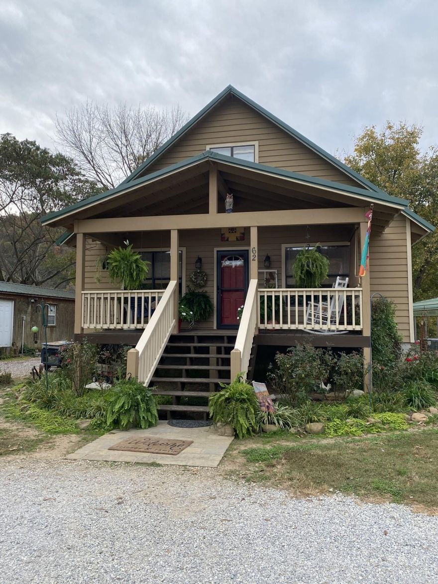 Beautiful riverfront home on the banks of the White River.  Located just minutes from Mountain View, Arkansas. This property offers breathtaking views of the river right from the back screened in porch.  The house offers 3BD/2 Bath with an open floor plan with fireplace and vaulted wood ceilings open to upstairs loft.  The second story has a large bedroom area as well as a open mezzanine seating area. Downstairs bathroom has been recently renovated with beautiful tile work. Whether your spending time on the front porch swing or by the fire pit in the back yard, this property will bring tranquility!  Property has two carports and a 12X30 storage building. Subdivision has a private  ramp.  There aren't many of these riverfront properties available!