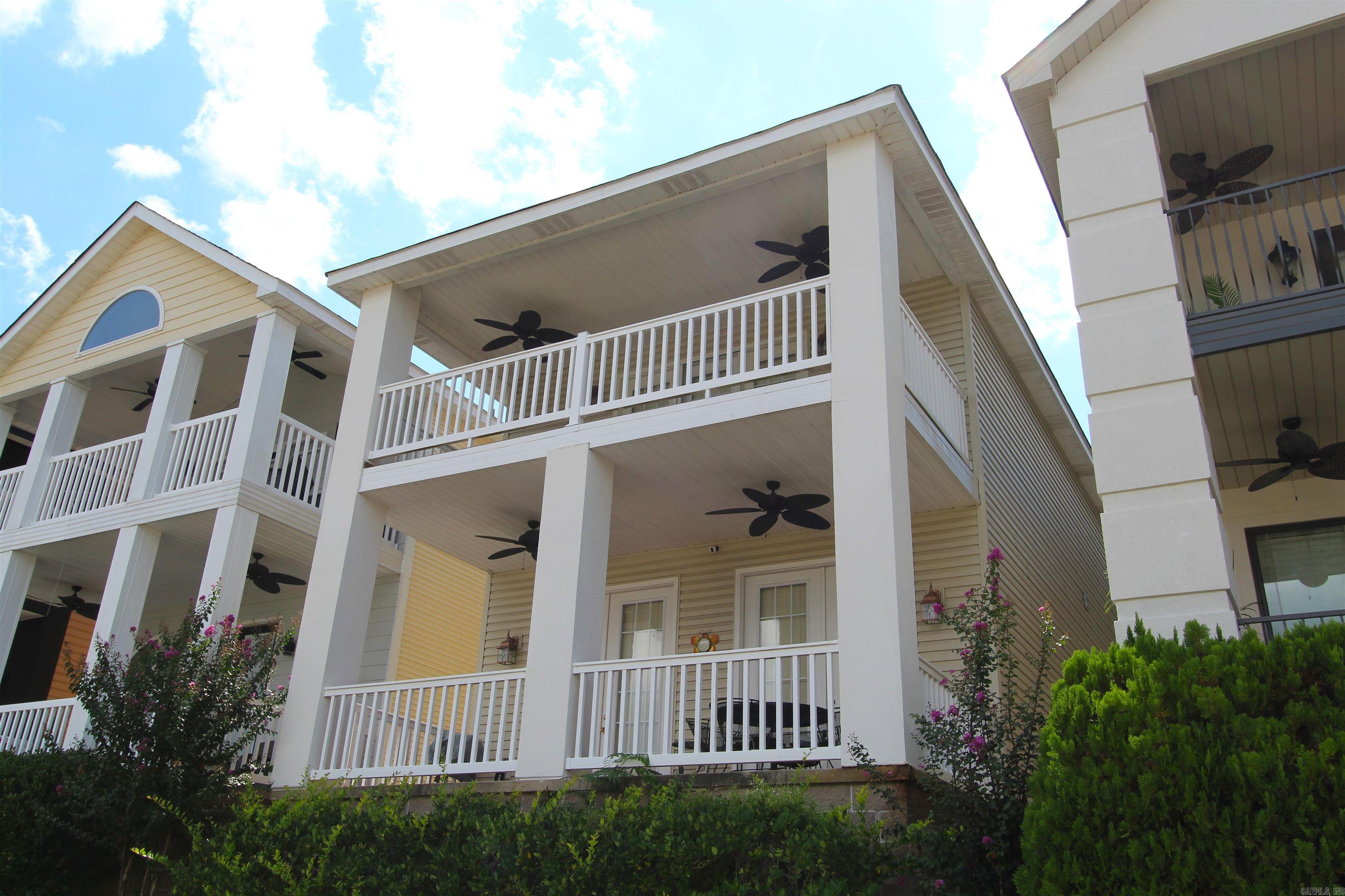 Want Lake Living, views, gated exclusivity, Hot Springs home? Then you have found it! This beautiful House has all the charm, with some views of Lake Hamilton. Upper and lower balconies give plenty of space to entertain or relax. Views of Lake Hamilton from the upper balcony. Kitchen backsplash just updated and new paint inside to give you a modern feel and that lake time vibe! Large rooms with separate bathrooms for everyone's privacy. Half bath down for that quick in and out to the lake. Nice Living area with soaring ceiling. Low Maintenance. New Roof in 2023! Come get your slice of the lake!
