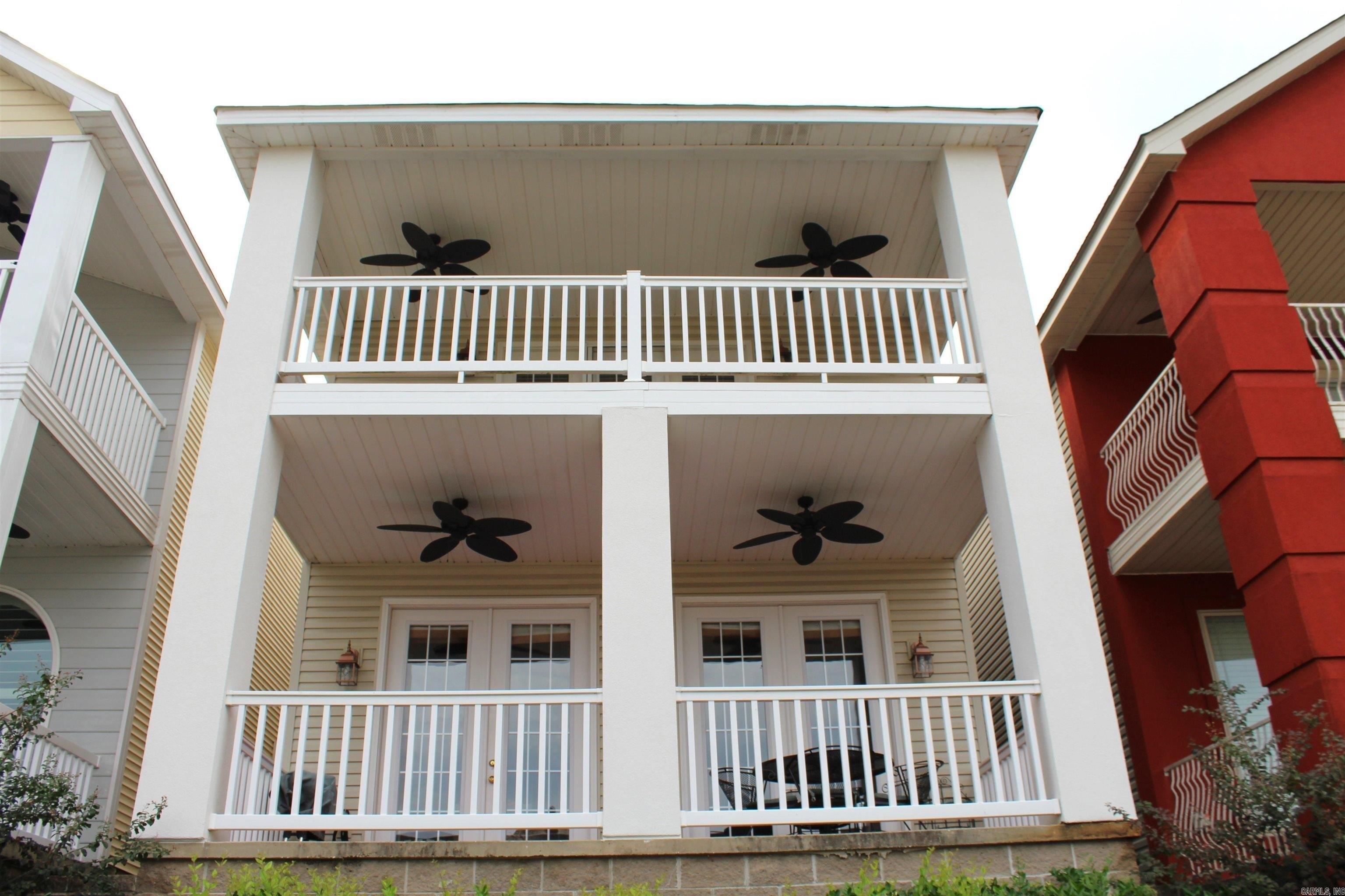 Want Lake Living, views, gated exclusivity, Hot Springs home? Then you have found it! This beautiful House has all the charm, with some views of Lake Hamilton. Upper and lower balconies give plenty of space to entertain or relax. Views of Lake Hamilton from the upper balcony. Kitchen backsplash just updated and new paint inside to give you a modern feel and that lake time vibe! Large rooms with separate bathrooms for everyone's privacy. Half bath down for that quick in and out to the lake. Nice Living area with soaring ceiling. Low Maintenance. Come get your slice of the lake!