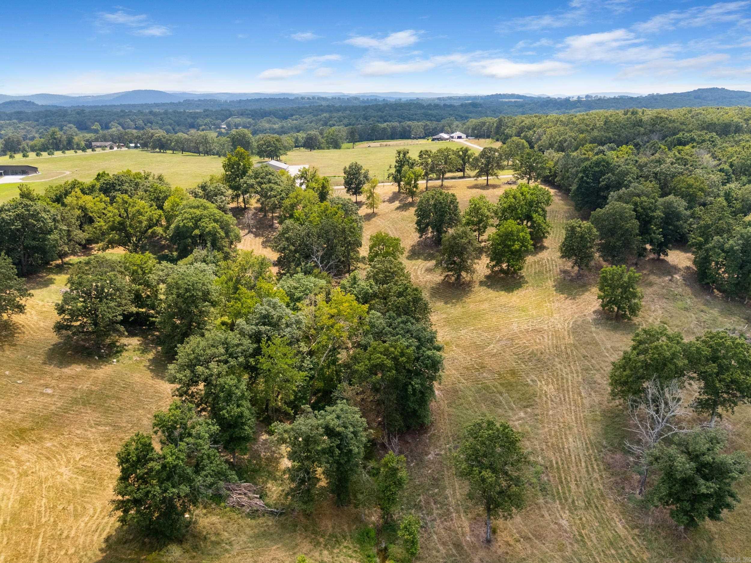 Just 5.5 miles from Mountain Home on a paved county road, this property offers 7 acres m/l with endless possibilities. Featuring beautiful views, mature oak trees, and open pasture, itās the perfect balance of scenery and usable land. Electric is available, and there are several excellent building sites to choose from. With county road frontage and a convenient location close to town, this land is ideal for building your dream home, hobby farm, or private retreat.