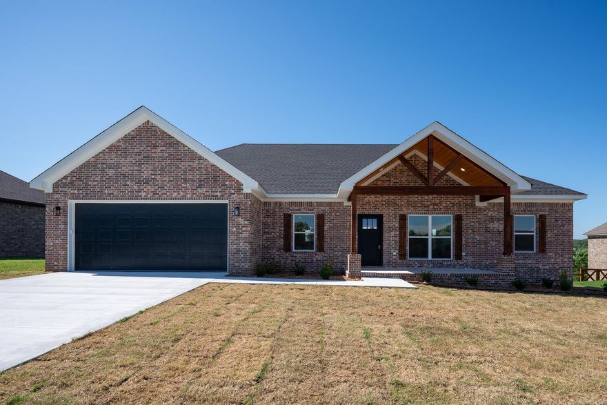 Beautiful new construction home in Persimmon Ridge Estates (home of Persimmon Ridge Disc Golf Course.) 3 bed, 2 baths with an open concept living/dining/kitchen area. Amazing master suite with large custom tiled shower in the master bath and walk-in closet that connects to the laundry room. This home boasts many extras that you will enjoy but to name a few: large back porch, stylish electric fireplace and a bonus room with a balcony/terrace that has it's own view.