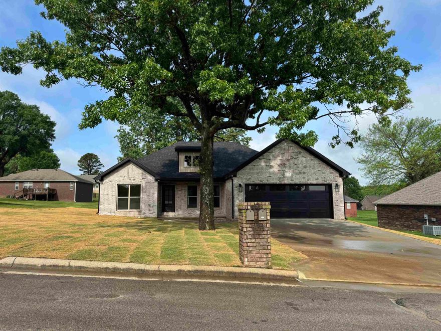 New Construction located in established well-maintained subdivision off Fairview Road in Paragould. This home is an eye catcher, so you do not want to let this one slip away. One level three bedroom home with upgraded quartz countertops. Black stainless kitchen appliances, large laundry room with built ins and quartz countertops. Upgraded entry with quartz bench and coat hooks. Primary bedroom apart with walk in closet and built ins, tile surround shower in both bathrooms. Waterproof laminate wood flooring throughout. Large covered back porch.