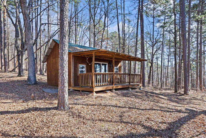 Tucked away on 4.82 beautiful acres in the heart of Logan County, this charming cabin offers the perfect escape for anyone who loves the outdoors. Located in a prime area for recreation, you’ll be just minutes from some of the best hunting, fishing, ATV riding, hiking, and exploring that the region has to offer.  The cozy cabin provides a comfortable basecamp for weekend getaways or a peaceful full-time retreat. Surrounded by nature and plenty of space to roam, the property offers privacy while still being conveniently located within Logan County.  Whether you're looking for a private recreational getaway, hunting cabin, or quiet country retreat, this property is ready to enjoy from day one — the cabin conveys with the sale.  Opportunities like this are hard to find in such a desirable recreational area. Come experience the peace, space, and outdoor lifestyle this property has to offer!