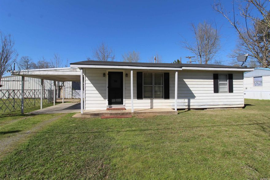 Adorable home within 4 miles of Sheridan*large bonus room could be an office or 3rd bedroom*the roof is only 6 years old and the carport roof is only 3 months old*well insulated*new septic system is only 4 years old*large laundry room*huge kitchen*nice size one car carport*metal siding*huge backyard*small outside storage shed*MOVE IN READY!*the age of the home is estimated but should be close*