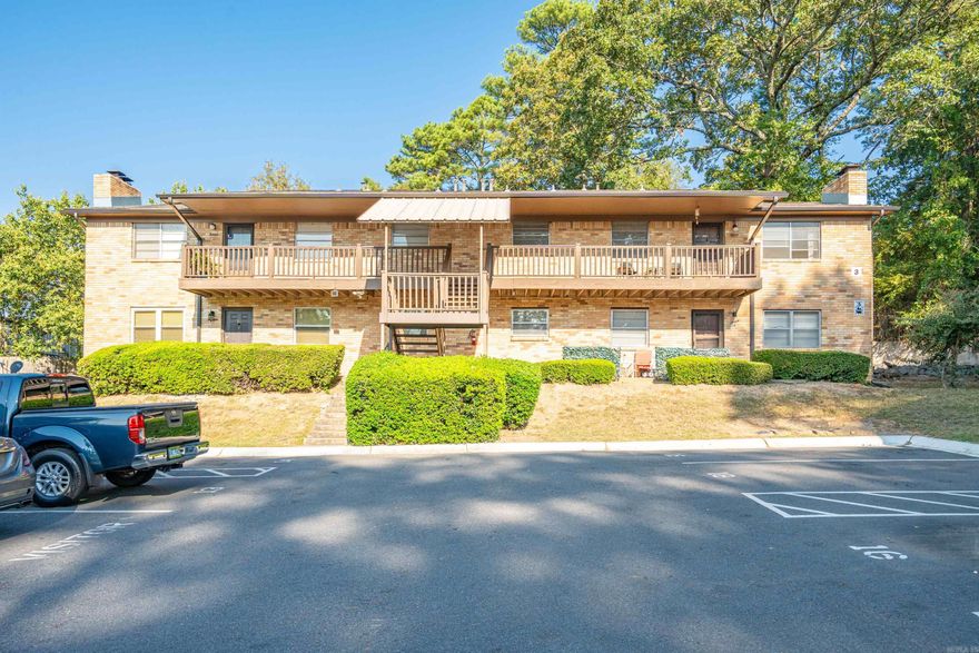 Whispering Pines Condo is a perfect place to call your new home or can be a great investment opportunity.  This 2-bedroom, 2-bath also features a bonus room that can serve as a 3rd bedroom.  Enjoy the natural views and wooded area from the private balcony.  This is an upper-end unit centrally located close to restaurants, shopping, and downtown, and only 1/2 mile to Oaklawn.  Designated parking, swimming pool, clubhouse, and hot tub are onsite for your enjoyment.  All appliances convey, new roof.  Schedule your showing today!