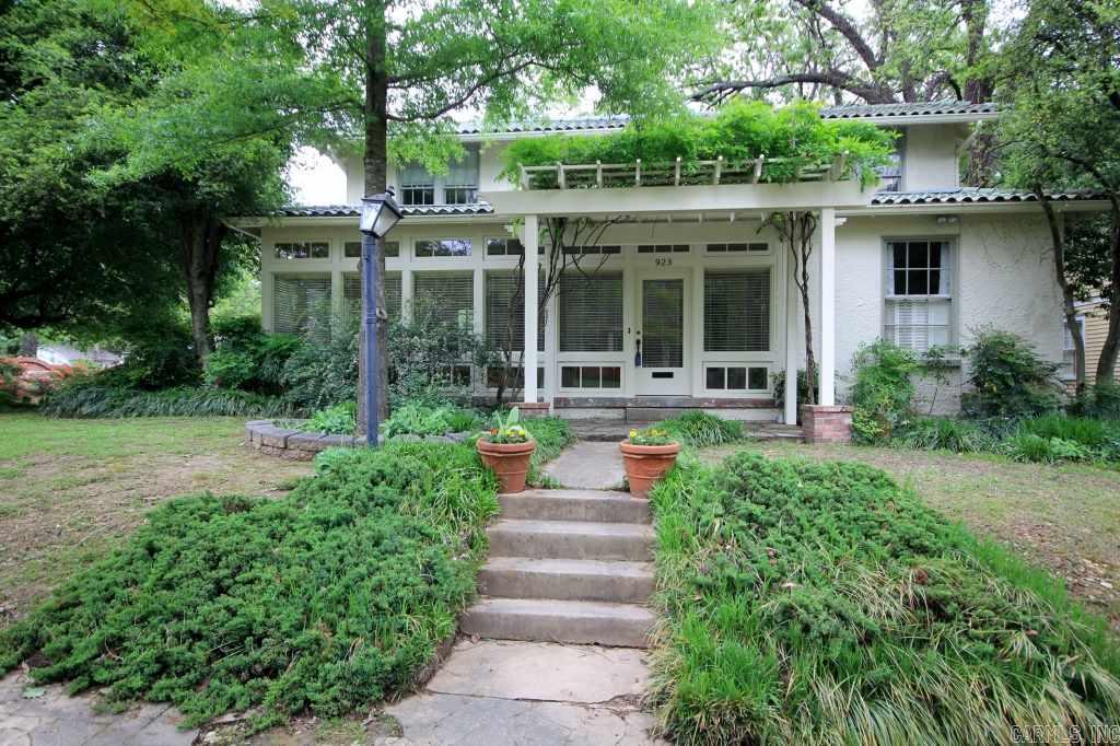 Architecturally significant home with master bedroom down. New kitchen appliances, carpet and paint. Rooms are generous in size. Wonderful glassed in front porch. Outside storage building. Corner lot. Approx. 294 sf front porch with window unit not included in square footage.