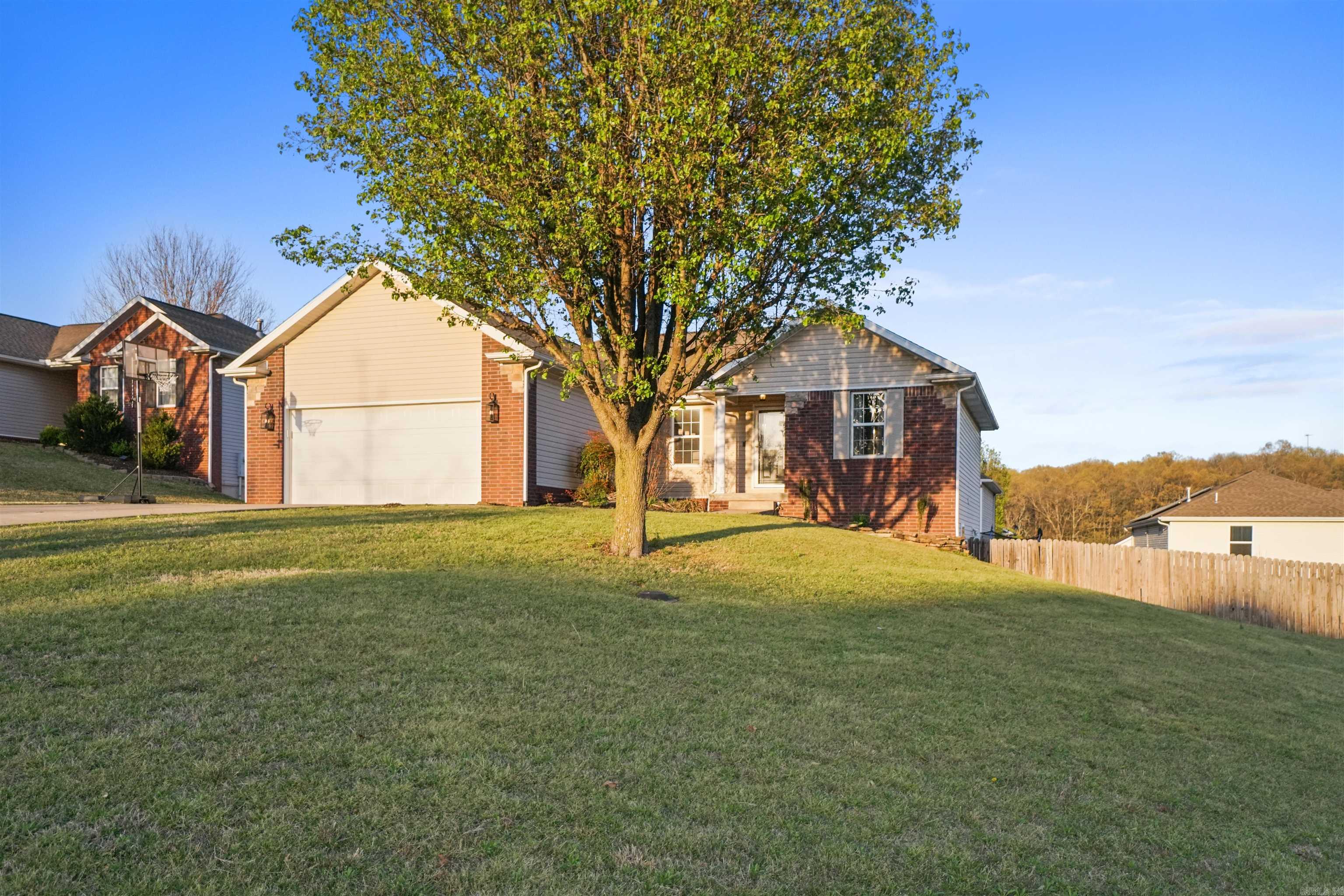 Beautifully updated 6-bedroom, 3-bath home on a corner lot of the Wellington Subdivision in Harrison, AR. Originally built in 2006, With a 1308 sq. ft. 1st floor and now with a fully finished basement combining for a total of 2,616 sq. ft. of modern living area. One of the downstairs bedroom is currently used as a home office, ideal for remote work or study. Renovations include two additional bedrooms, a finished shop/workspace, new flooring, doors, trim, and paint. Enjoy stylish accent walls, shiplap paneling, and re-textured ceilings, along with upgraded lighting, smart locks, and smart switches for added comfort and convenience. This home stands out in the neighborhood, where similar floor plans often feature unfinished spaces. Conveniently located just minutes from local restaurants and amenities. Only 40 minutes to Branson, MO for shopping and entertainment, and 30 minutes to the Buffalo River for hiking, fishing, kayaking, and more. Truly a home with space, style, and functionality and a convenient location—don't miss this one!