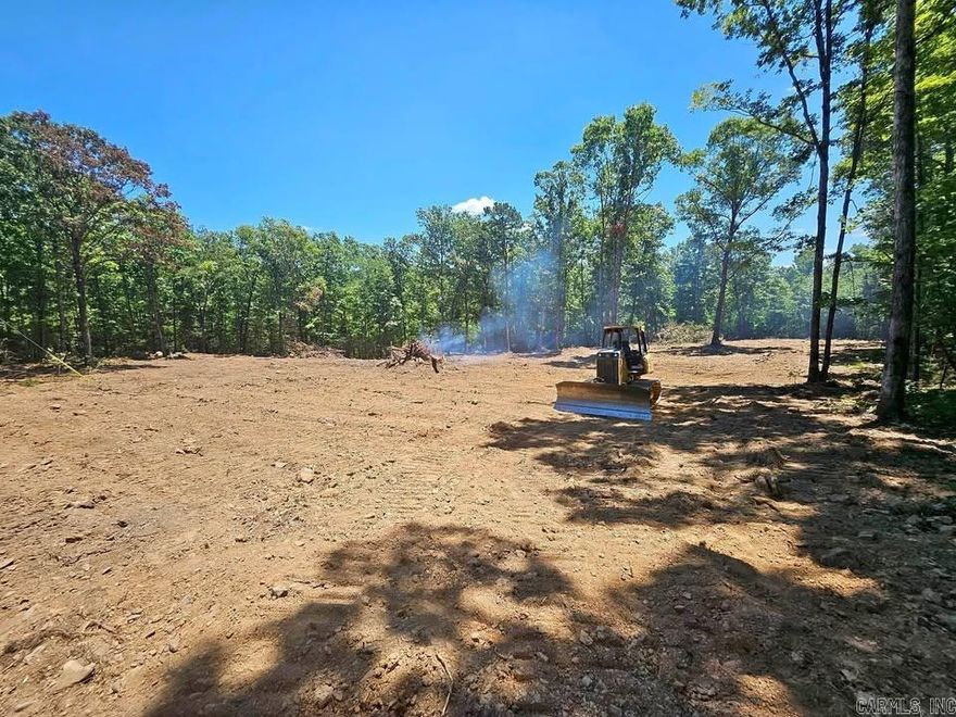 Beautiful 9.02 acres in Peedee close to Greers Ferry Lake. Surveyed, flagged, & perc tested. Utilities available on site, electric & fiber internet with Petit Jean. Approximately 2.5 acres cleared & has running seasonal streams through property.  No owner financing.