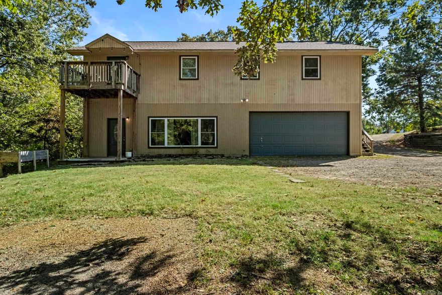 Beautifully remodeled and move-in ready 2-story home on 1.7 acres just off West Country Club Road, within close distance to the Searcy Country Club! Primary suite with full bathroom downstairs plus 3 large bedrooms and 2 full baths up, including a 2nd primary with private deck.  Granite countertops, stainless appliances, oversized 2-car garage with great storage, and a spacious laundry/mudroom that could serve as office space. Two bedrooms upstairs can share bathroom separated by sliding shelf & mirror. . Plenty of room to add a garbage or shop! Agents see remarks.