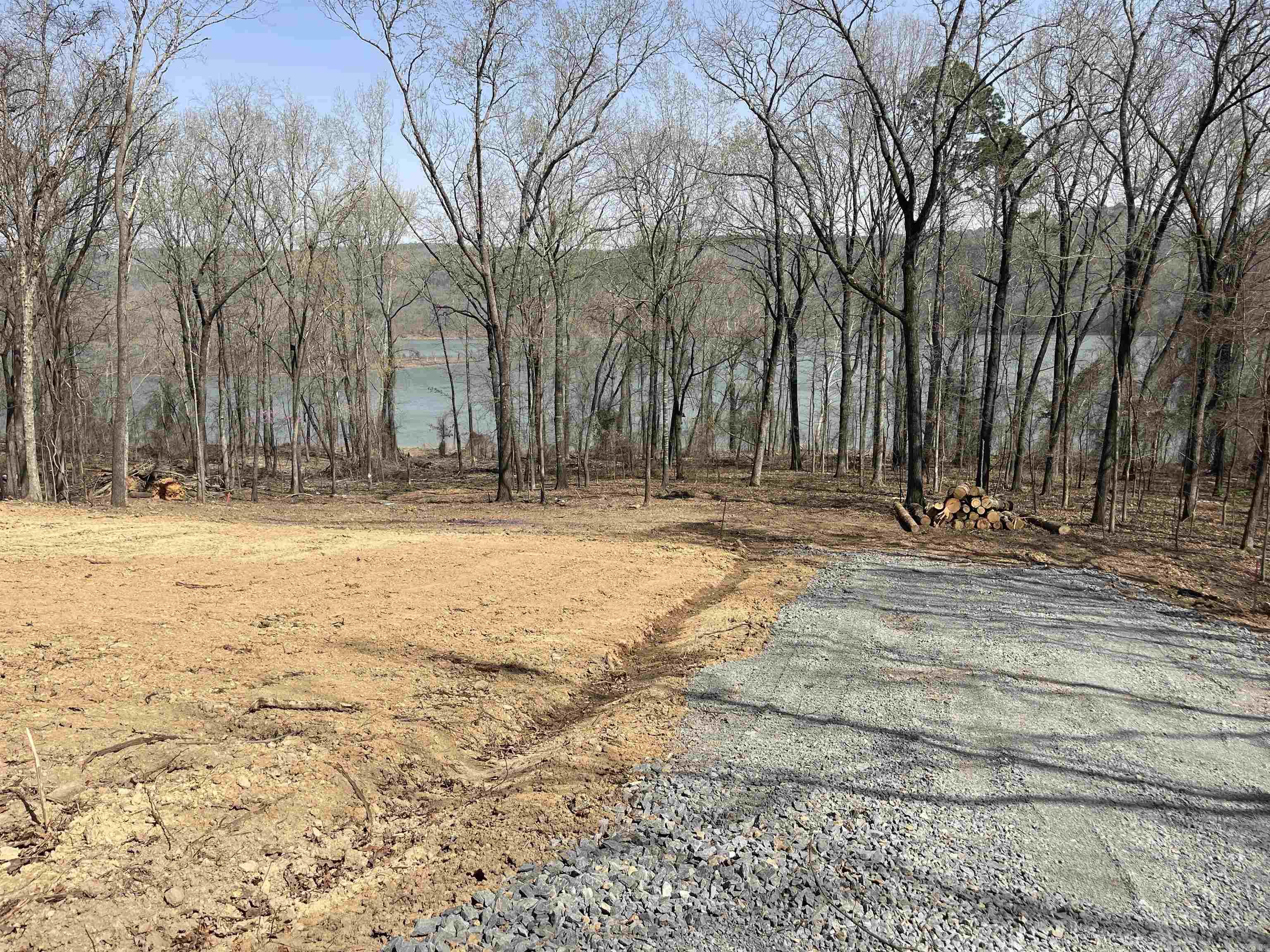 See survey including all lots #55,56,57, & 60 totaling approximately 2.05 acres located in āWatersedge Subdivision Ph. IIIā. Water meter already installed at the road. Septic permit online under "docs" and survey online as well. No mobile homes allowed (see recorded covenants). Walking distance to Boat Slip #14 in Community Dock. There is also a grass/dirt path at the end of Lower Ridge Circle for another public access to the water. There is a designated parking area for slip owners near the dock and when you walk on the dock walkway, at the end , go right and itās the 4th slip down.