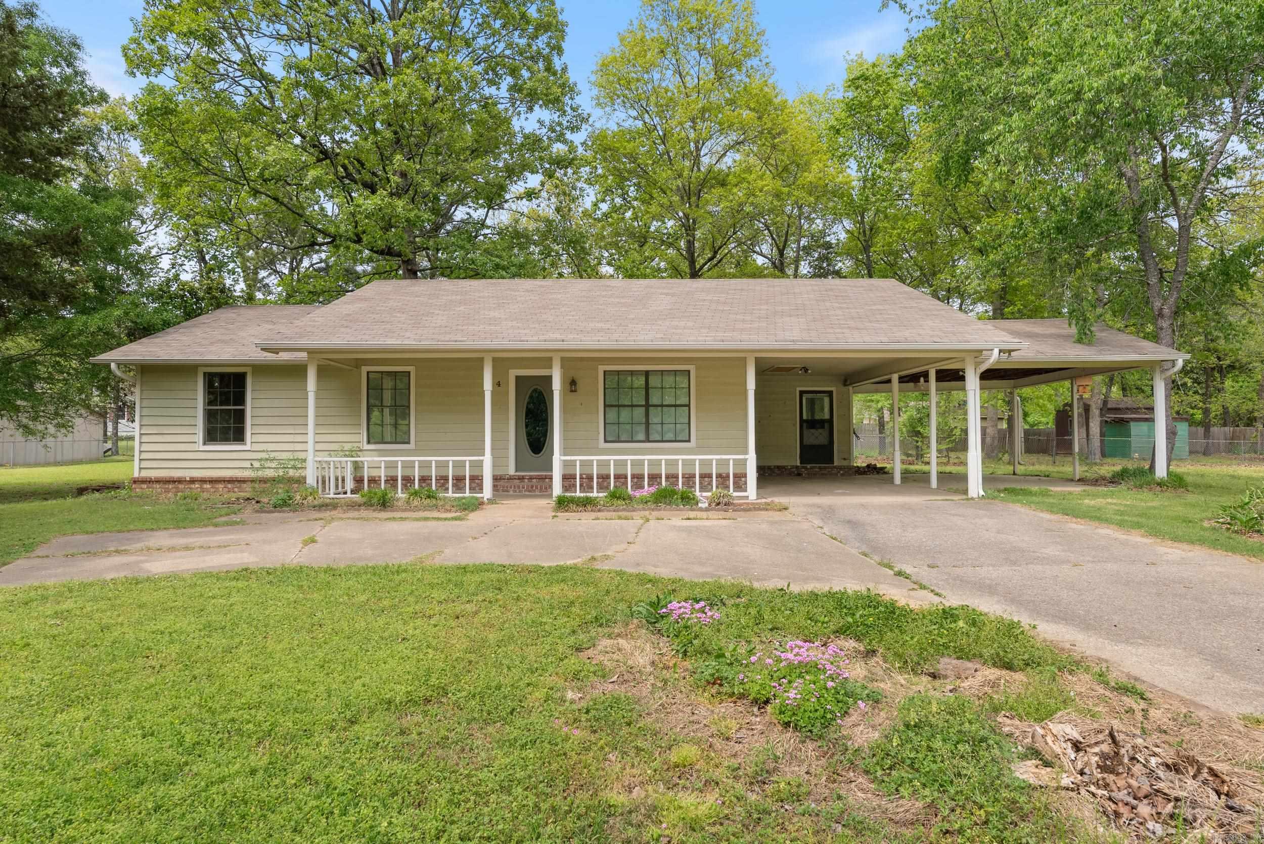 Country Living with City Convenience-Qualifies for 100% financing! Located on a beautiful half an acre lot with apple & pear trees, this charming home offers 3 bedrooms, 2 bathrooms, Sun room/Office, 1,621 sqft of living space and a large fenced in backyard. In 2016, this home was COMPLETELY renovated that included the rebuilding of the large sun room to include heat & air, NEW granite counter tops, tile, range and microwave, new sink, new disposal, and faucet in kitchen, NEW ceiling fans, lighting, fresh paint interior & exterior, new toilettes, new bathroom counter tops, new hardware & new carpet, NEW HVAC, roof & front and back guttering. Recent updates include NEW water heater (2023) & HVAC (2022). Spacious laundry room offers built-in cabinets and shelves for extra storage. Second driveway, two carports and extra side yard space is perfect for gatherings. Storage shed included! Wonāt last long! Schedule a tour today. Agents see remarks.