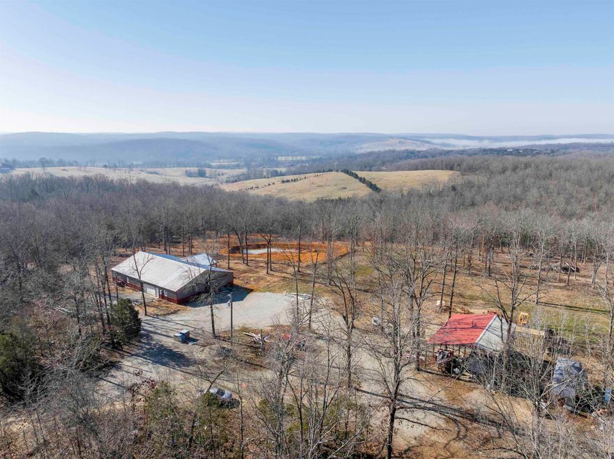 101 Acres in Sharp County, AR – 2023 Barndominium with Shop, Ponds & Mountain Views  Private recreational homestead in the Ozark Mountains featuring a 4,000 sq ft spray-foam insulated barndominium built in 2023. Approx. 2,000 sq ft heated and cooled living space plus 2,000 sq ft insulated shop w/ wood stove. The home offers 2 bedrooms, 2 baths, open concept kitchen (14x17), living & dining (25x22), pantry 4'x6', spacious primary suite (15x25) with large walk-in shower, oversized closet and laundry room. Central HVAC with backup wood insert.  Situated high on 101 wooded acres with breathtaking vista views overlooking pasture and timber. Land includes 2 ponds, wet weather creek, prime deer & turkey hunting, rolling terrain and ATV trails. 12x30 covered front patio and 40x30 pole barn (2 sides enclosed). driveway off paved highway—easy access with total privacy and no road visibility.  Ideal Ozark recreational property, hunting land, or rural homestead.