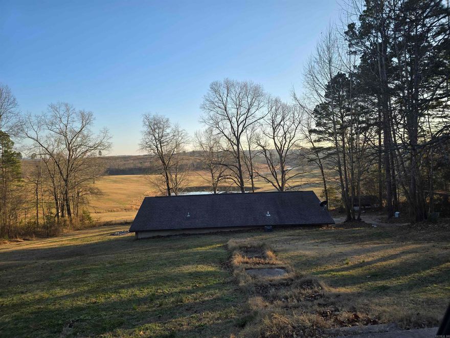 Who wants a million dollar view for ONLY 195K? Nestled in the rolling hills of the much sought out Ozark Mountain foothill sits this beautiful, custom built in 2014 log berm home! At over 1300 sq ft, there is plenty of space for your family! This home also sits on over 3.5 +/- Acres so you will have room to add on or build additional structures. This open floor plan features 2 bedrooms and 2 bathrooms and also laundry room. The home has recently been updated with new paint as well. In 2022, the kitchen was upgraded and remodeled as well as the living room. New windows were also added in the bedrooms in 2022. Stepping out of your back door is a spectacular view of the surrounding farm with a gorgeous pond! Absolutely picture perfect! Do not hesitate to reach out and get in to see this once in a lifetime property in the beautiful Natural State!