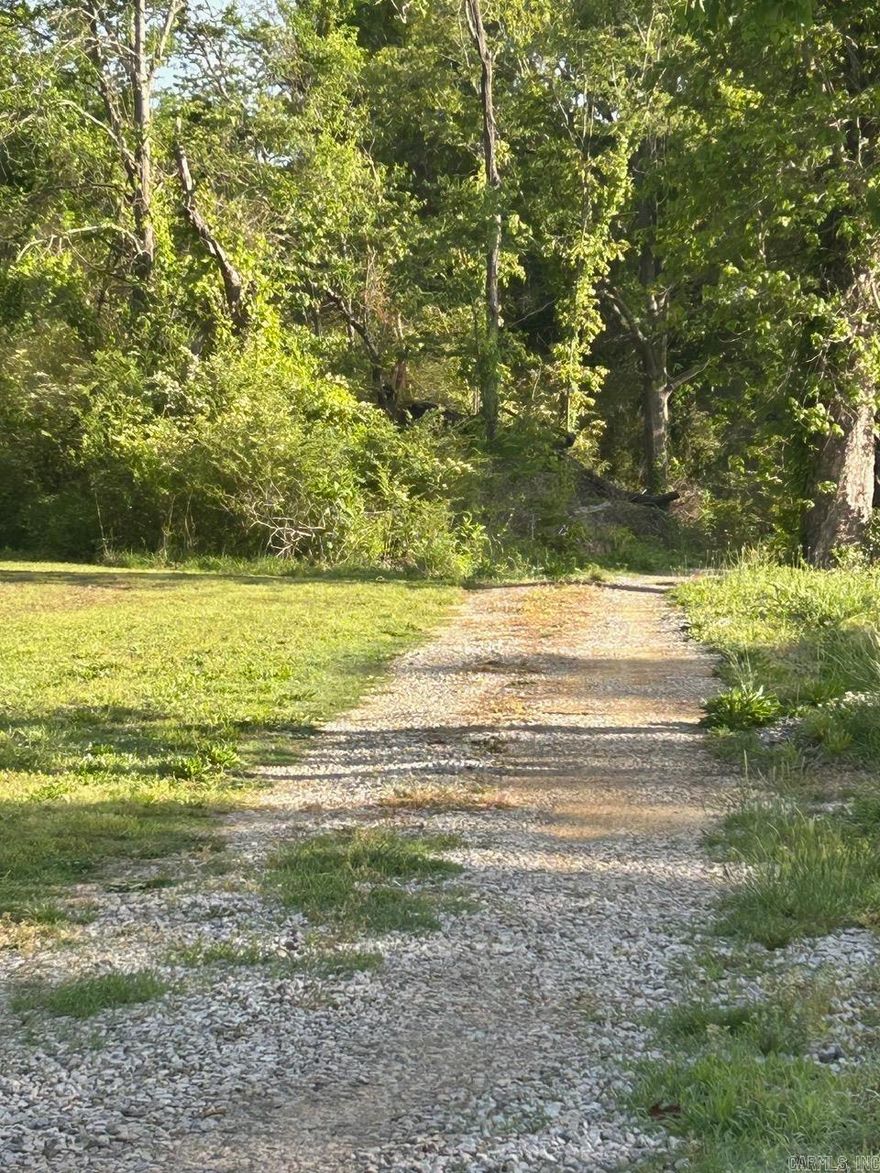Secluded setting, private 5 acres will all utilities, new survey w corners marked new septic, electric service, and Searcy water all on site.  Lots of timber, road has been cut in all the way to the back of the property and gravel added.  Located off a paved road, just minutes outsider of Searcy.   A rare find ready for your dream home. Minutes to interstate and airport