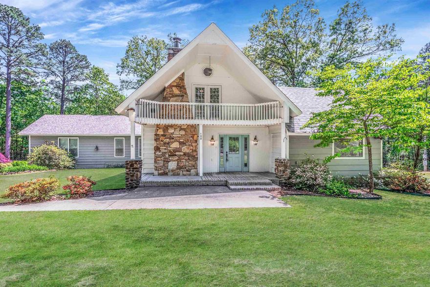 Welcome to your own slice of peace & privacy just minutes from Greers Ferry Lake! This 3 bedroom, 3 full bath home offers a spacious living room with a vaulted ceiling, a stunning wood burning stone fireplace, & a kitchen with abundant cabinets & ample countertop space! The upstairs loft bedroom comes complete with a private balcony- perfect for enjoying your morning coffee. The outside features a 2 car garage, 20x32 storage building with concrete floor, outdoor fire pit, & a beautifully landscaped yard with Japanese Cherry Blossoms, Dogwoods, & Crepe Myrtles. Set on two lots totaling 0.87 acres +/-, the property boasts a well maintained Zoysia grass lawn with a complete in ground sprinkler system. The location of this home seals the deal! You're just a short walk or ride to the neighborhood boat launch & approx. 3 miles from South Fork lake access. Fairfield Bay Marina is approx. 15 minutes away. Whether you're looking for a full time home or a weekend retreat, this property offers space, charm & easy access to everything the lake has to offer!