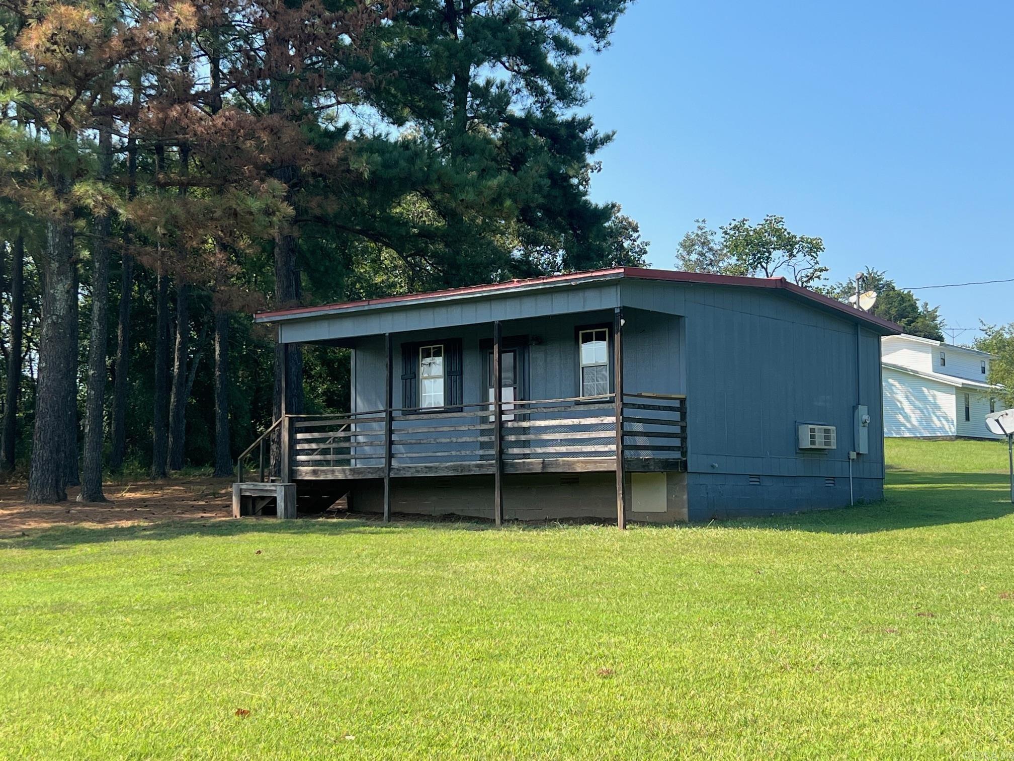 Excellent weekend getaway, Air BnB, Hunting Camp, starter home, or rental tucked into the southeastern shadow of the Ozark-St. Francis National Forest! Within 5 minutes of National Forest Public land and some of the most scenic natural beauty offered in the Natural State, this cabin is exactly what you need to get away and enjoy time with friends and family coupled with tranquil serenity and all of the outdoor fun the Ozarks have to offer. The cabin boasts a kitchen area, living space, sleeping space, HVAC, and full bathroom with municipal water, electricity, and septic already on-site and installed! All of these amenities in this location at this price won't last long! Call to schedule a showing today!