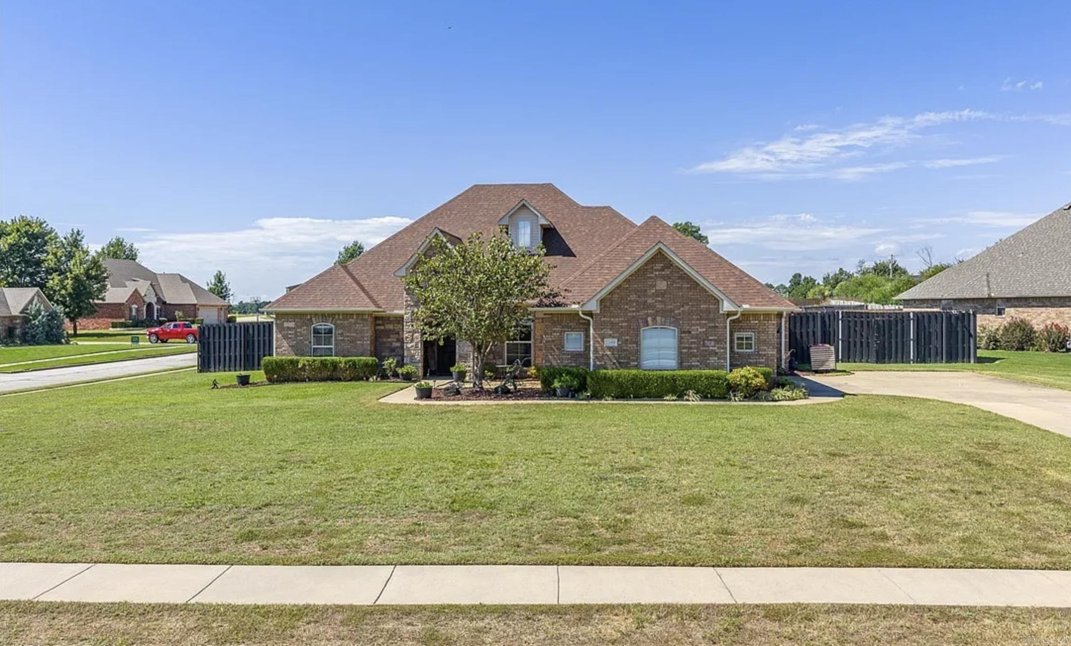 Set in the beautiful Blackstone Ranch community in Fort Smith but within the award-winning Greenwood School District, this home blends modern upgrades with everyday comfort. With 2 living areas and a formal dining room, the layout offers flexibility for gatherings, dinners, or cozy nights at home. Wood floors extend through most of the home, while granite countertops elevate the kitchen, all 3 bathrooms, and the laundry room. The heart of the home is the kitchen, designed for both function and entertaining, featuring a gas stove, double ovens, and new microwave and dishwasher. A generous eat-in space invites casual meals, coffee, or late-night conversations. Fresh paint, updated lighting, ceiling fans, and exterior sconces create a polished, move-in ready feel. Additional highlights include a 3-car garage with insulated doors and shelving, high-efficiency HVAC, wired sound, and security systems. Outdoors, enjoy a pergola, fire pit, raised garden beds, hammock posts, and astro-turf play area. The oversized patio is ideal for entertaining, all within an 8-foot privacy fence. Love where you live in this Blackstone Ranch retreat.