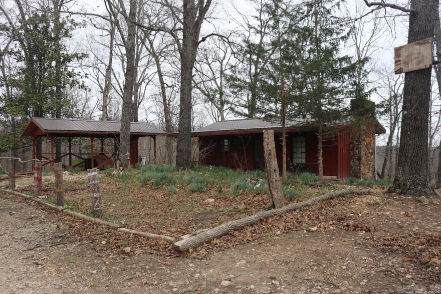 This 1 bed, 2 bath cabin offers a solid foundation and rustic charm, ready for your personal touch. With a little TLC, you can transform this into the perfect cozy escape.   Property Highlights:  8.68 acres of scenic, wooded land  Gas log fireplace for those cozy mountain evenings   1 bedroom, 2 bathrooms  Carport & back deck for relaxing and entertaining  Rare spring water source – hard to find and highly desirable  Abundant wildlife – perfect for hunters and nature lovers   Ideally located just one parcel away from the Ozark National Forest and only 15 minutes from the stunning Blanchard Springs Caverns.  If you’ve been dreaming of owning a slice of the Ozarks, this is your chance to invest in a property with incredible potential in a highly sought-after area.