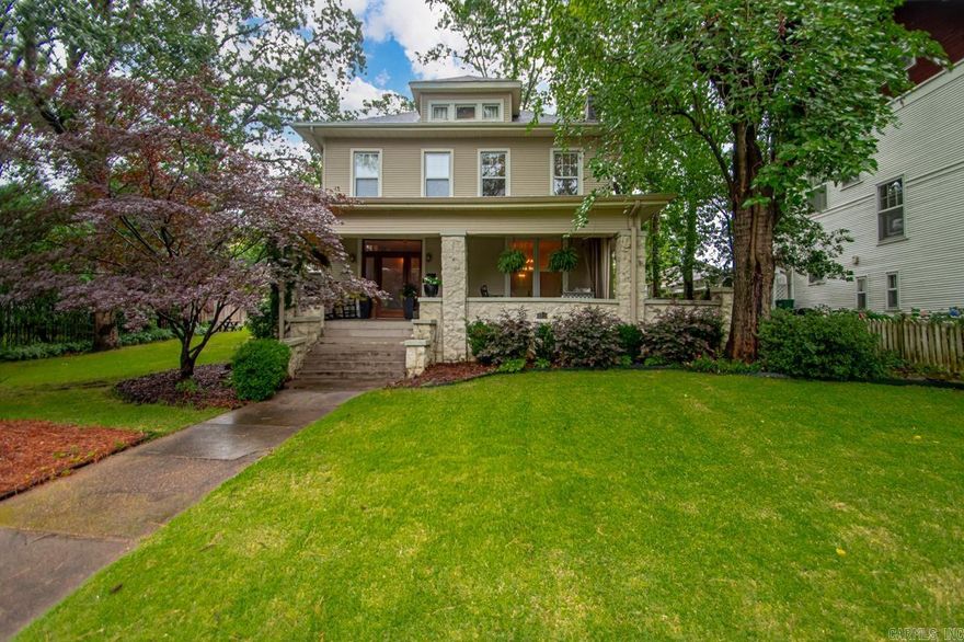 Welcome to this beautifully updated Hillcrest Craftsman, where charm and character blend seamlessly with high-end modern amenities. From the moment you step through the front gate, you'll be drawn in by the inviting front porch—perfect for morning coffee or evening relaxation. Inside, a traditional foyer opens to spacious living and dining rooms, adorned with original pocket doors and rich architectural detail. The expansive kitchen is a chef’s dream, featuring premium appliances, ample counter space and easy access to a thoughtfully designed mudroom with custom Elfa storage—ideal for keeping your home organized and clutter-free.  Upstairs, retreat to the stunning primary suite, inclusive of heated tile floors and a cozy fireplace. Convenience abounds with laundry hookups on both levels. Enjoy the outdoors year-round on the beautiful screened porch, or entertain in the fully fenced backyard garden. The property also includes a two-car garage and additional parking pad accessible via the alleyway.  Classic charm, modern comfort, and unbeatable location—it’s all here.