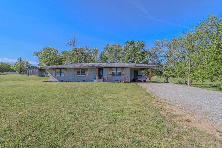 This charming 3-bedroom, 2-bath brick home is a real gem! With a new roof, heat and air system, and appliances, it's practically brand new. The home also boasts a new hot water tank, light fixtures, plugs, switches, sinks, toilets, cabinets, and countertops throughout.   The home has a crawl space, gas cook stove, heat, and water heater. The flooring is a mix of comfortable carpet and sleek laminate. Plus, the walk-in shower adds a touch of luxury.   Situated in a fantastic location, the property includes over half an acre of land. If you're looking for more space, additional acreage is available. This home is perfect for anyone looking for a fresh start in a beautiful, updated home!