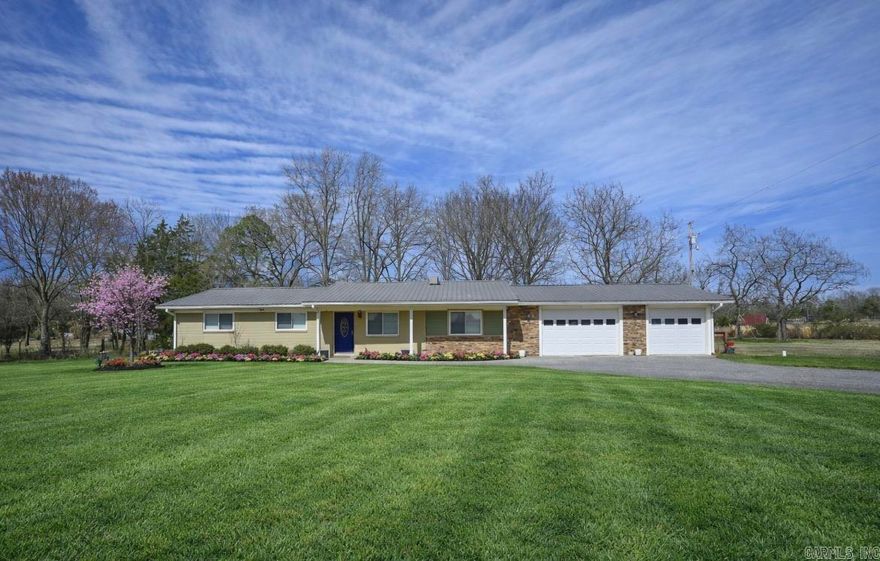 Enjoy the perfect balance of convenience and outdoor living with this charming 3-bedroom, 1-bath home situated on approximately 2 acres just minutes from town. Offering 1,431 sq ft, this property provides space, privacy, and direct access to the lifestyle that makes the Ouachita Mountains so special. Located less than a half mile from Board Camp Creek and near a county road providing access to the Wolf Pen Gap ATV Trail System and Ouachita National Forest, this property is ideal as a full-time residence, vacation retreat, or potential short-term rental investment. The home features new flooring, a durable metal roof, tankless water heater, and a two-car garage. The acreage includes a creek setting, creating a peaceful outdoor environment with room to relax, explore, or expand. Whether you're looking for everyday living close to town or a weekend getaway near trails and national forest access, this property offers versatility and opportunity in a highly desirable location.