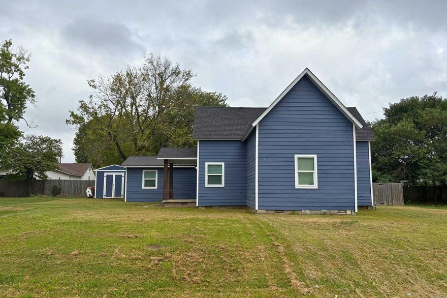 This charming 1,300 sq ft home offers a delightful experience from the moment you step inside. The cozy living room features an electric fireplace, elegant LVP flooring, and stylish crown molding. The beautifully remodeled kitchen showcases updated light fixtures, an island, stainless steel stove and dishwasher, and a tile backsplash. Enjoy hosting gatherings in the fenced backyard, complete with a covered deck for year-round enjoyment. The primary bedroom boasts a walk-in closet and direct bathroom access, while the two additional bedrooms offer versatility and ample space. Perched on an expansive double lot, this property provides plenty of outdoor space for relaxation and recreation. Don't miss the opportunity to experience the many thoughtful updates and comforts this home has to offer! **AGENTS SEE REMARKS**