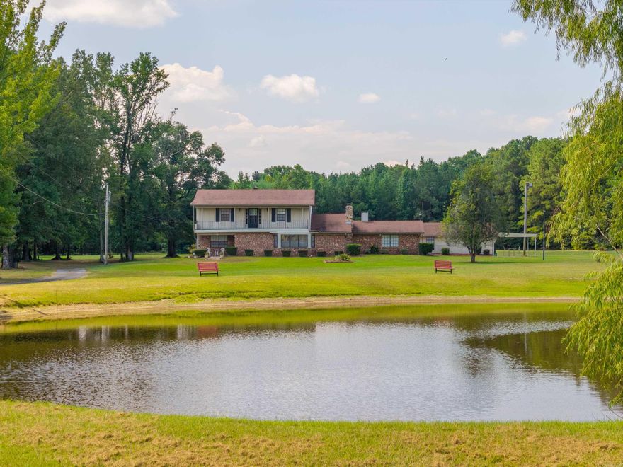 Approximately 3,000 sq ft house sitting on 29 m/l acres in White Hall School District! This property features a large usable front and back lawn, paved driveway, and a pond stocked with catfish. Plenty of room for all the outdoor activities. Inside the home you will find a nice 2 story layout. All the rooms are generous in size. The sunken living room has a wet bar and oversized TV, perfect for entertaining guests. Front and rear balcony's overlook the property. 2 car garage, carport, and detached game room.