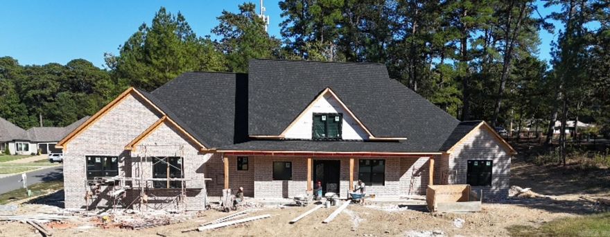 Nestled in the desirable Arlington Park neighborhood of Hot Springs, AR, this stunning Single Family home will be completed in early 2026. Boasting 4 bedrooms, and 3 and 1 half bathrooms, with a private office near the front door, this property offers ample space for comfortable living. The Back porch comes with a real wood burning fireplace and over 800sq ft of covered outdoor patio space for relaxation and entertaining. With modern amenities and stylish finishes, this home is the perfect blend of luxury and functionality. Don't miss your chance to own this exquisite property in a sought-after location.