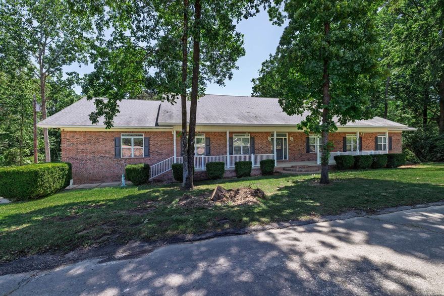 Welcome to your dream home situated just outside of Arkadelphia, nestled on over 2 acres of picturesque land. This stunning residence boasts 3 spacious bedrooms and 2 full baths, complemented by 2 additional half baths for convenience. As you step inside, you will be greeted by a beautiful open-concept living and kitchen area, perfect for entertaining or family gatherings. The kitchen features brand new appliances, ensuring a modern and functional space for your culinary adventures.The spacious den invites you to relax, complete with a cozy fireplace that adds warmth and charm. You'll love the new carpet that enhances the comfort of the living spaces throughout the home. Retreat to the luxurious master suite, which offers a huge walk-in shower and a soothing soaking tub, creating your own personal spa experience. The oversized garage provides ample storage and parking space, while the heated and cooled basement, equipped with a half bath, offers additional versatility for recreation or guest accommodations. Step outside to your beautiful sunroom, where you can unwind while overlooking the serene woods and creek—an idyllic spot for morning coffee or evening relaxation.