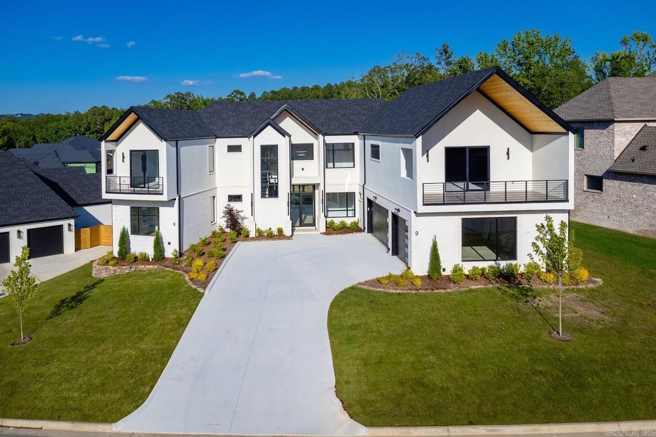 This stunning new construction can be found in Abington Court in Chenal Valley. If you are looking for a 5 bedroom home, all with private bathrooms, this could be the home for you. Floor to ceiling windows are the setting for the homes breathtaking entry and living space. The open great room and kitchen feature a wall of panoramic doors, a gateway to indoor-outdoor living. The design details in the primary suite on the main level of the home, with a spa bath and walk-in shower are astounding. And if you love closets this is amazing! Need an office or work-out room? There is a flexible space in the home that can be used as you wish! Also on the main level of the home is the second bedroom with an en-suite bath. The other three bedrooms with en-suite baths are located upstairs along with a media/game room. This spectacular home is estimated to be completed in Spring 2025.
