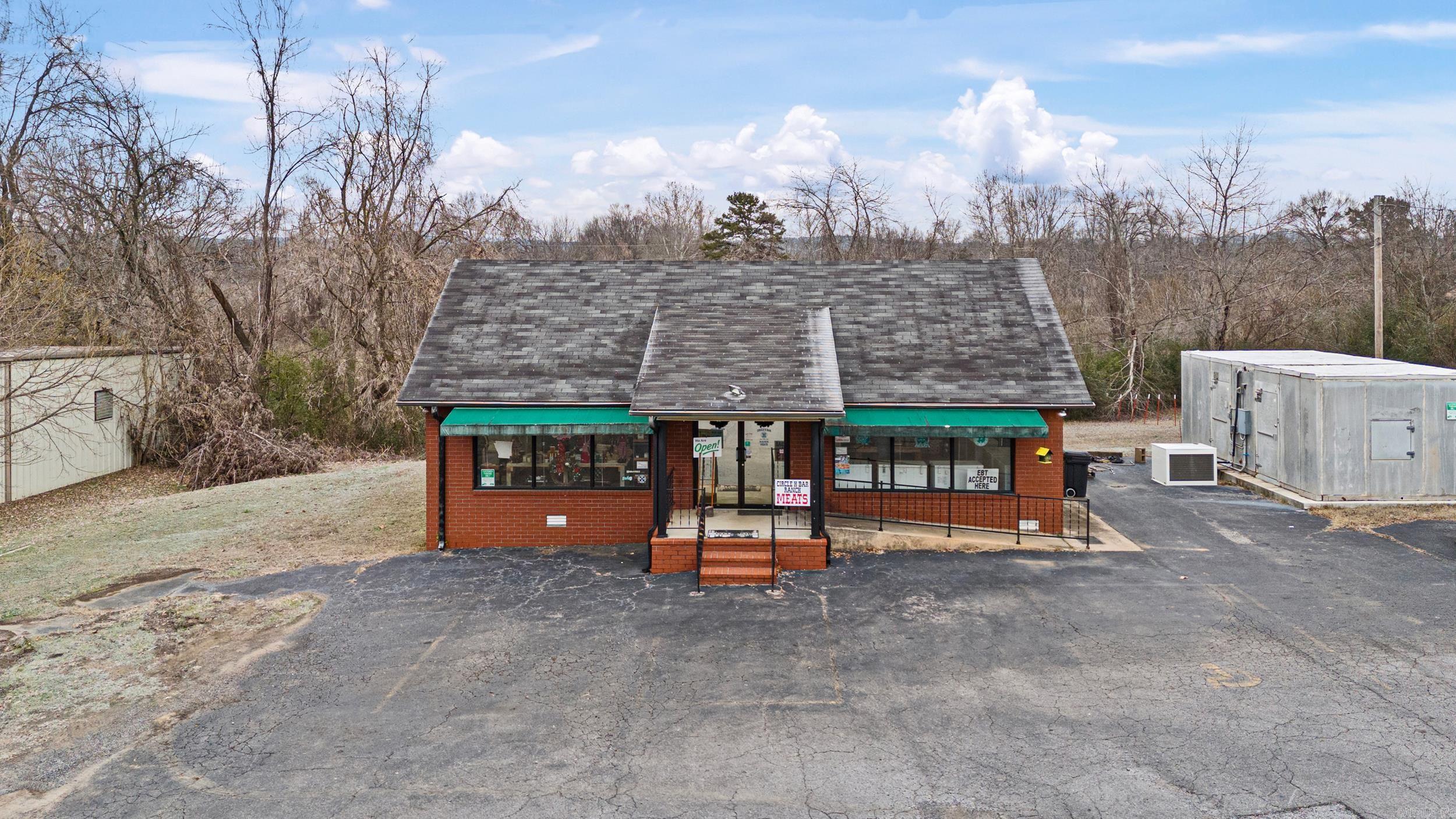 Prime commercial property with high-traffic Hwy 64 frontage and ample parking, offering endless business opportunities! Just 1 mile from downtown Clarksville, AR. This 1,440 sq ft commercial building is perfect for retail or entrepreneurial ventures. Features include: Brand New LVP Flooring ⢠A 12x24 walk-in freezer ⢠11 chest freezers ⢠1 stand-up freezer ⢠2 refrigerators Currently set up as a Farm Fresh Retail Meat business, this property is ready for you to step in and start operating or repurpose it for your own commercial needs. With its excellent location and turnkey potential, this is a must-see opportunity!