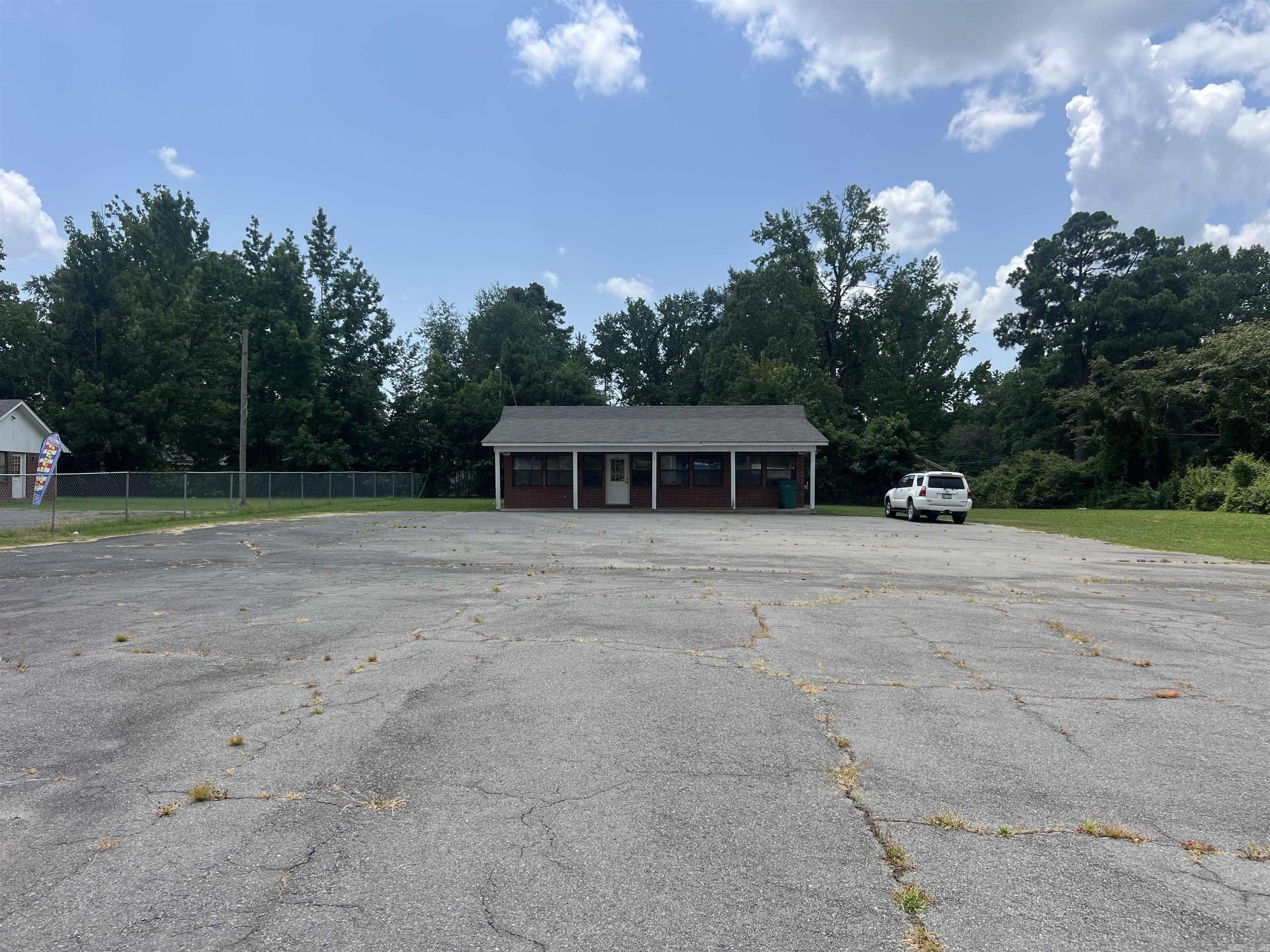 Great investment opportunity, this former used car lot is located in a high traffic location and would be great for another car lot, a real estate or tax office or a hair salon plus many other choices. If you are looking for a high traffic, high visibility location in between White Hall and Pine Bluff, this is the perfect location!