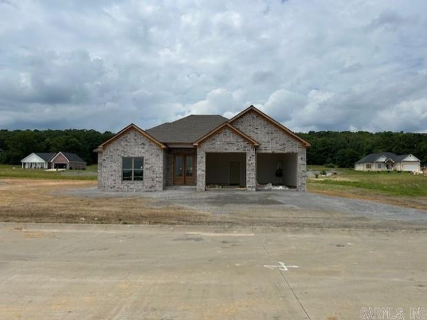 Gorgeous new construction in Vilonia's Ridge View neighborhood. Brilliant open concept floor plan with tons of extras throughout. This home is perfect for entertaining and spending time with family and friends. You can be in the kitchen and still interact with family and guests in the dining and living areas. Beautiful quartz countertops, custom backsplash, and a large pantry in the kitchen. Split floor plan for the bedrooms. The primary suite features an oversized custom tile shower. Good sized walk-in closet, and nice laundry room. Outside, you'll find a covered patio that's perfect for enjoying your morning coffee. Great location with easy access to Conway and the Little Rock Air Force Base. Schedule your private showing today.  Agents, see remarks.