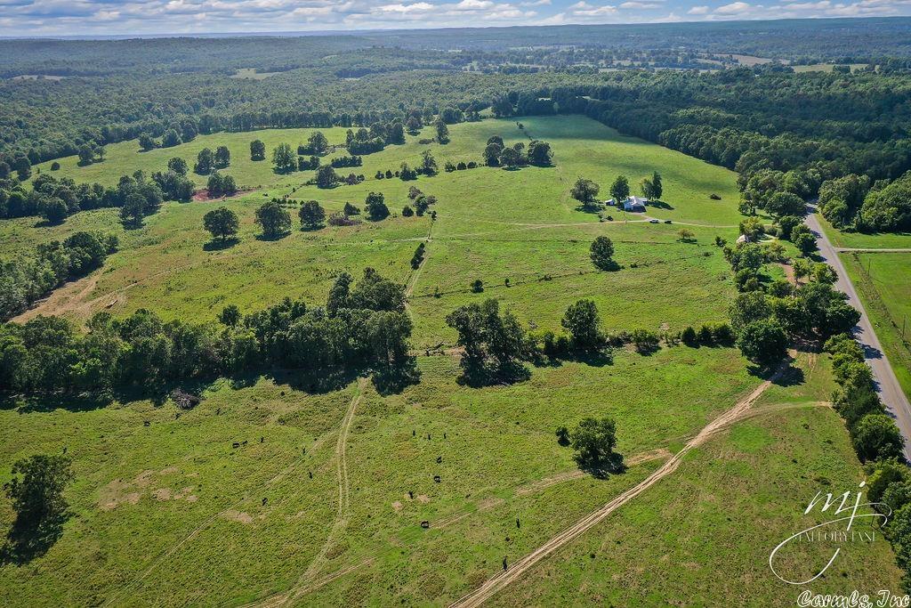 Sharp County Arkansas Ranch...495 acres, more or less, just 5 minutes out of town, with 1 mile of State Highway 354 frontage. Mostly open pasture, good fencing, six ponds, creek, and terrific hunting. Old barn, well maintained 3 bedroom ranch home, scenic building sites galore, well and public water.