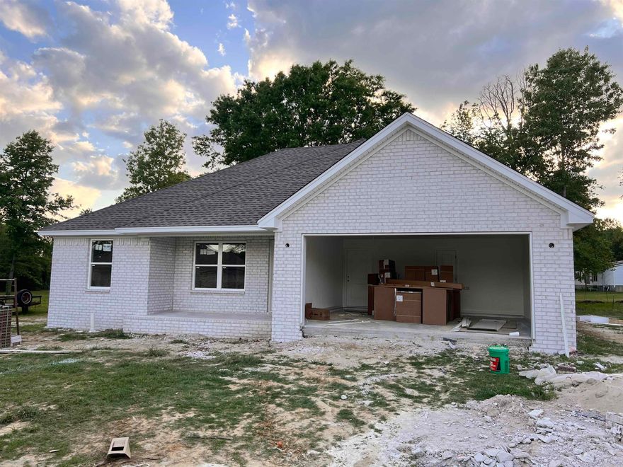 All brick home under construction inside city limits!!!  Final build to contain Granite countertops in kitchen and baths along with luxury vinyl plank flooring throughout.  9-ft ceiling in kitchen and living area along with huge picture window in living room. Spacious walk-in closet and private master bath.  Laundry room conveniently located off the 2-car garage. City conveniences but a feel of country.  Estimated completion April 2026.