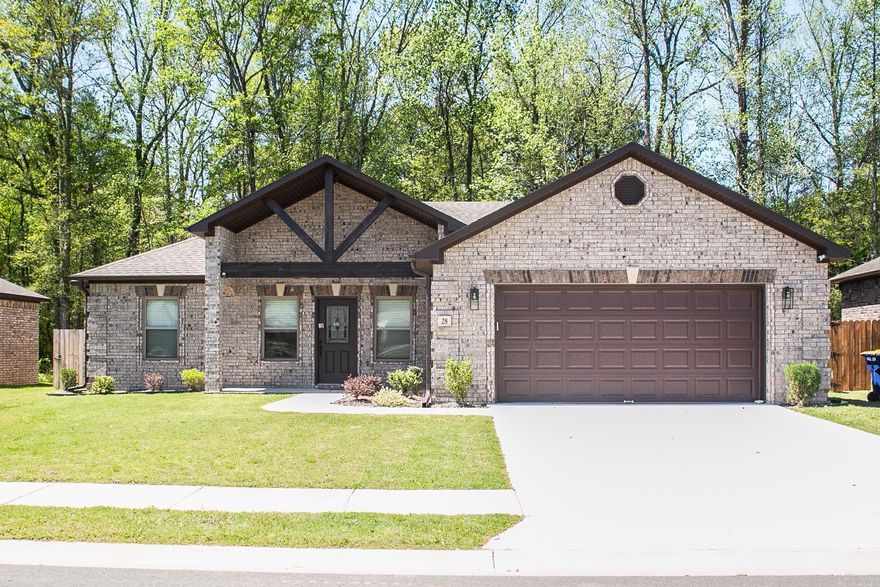 Welcome to your spacious home in the Cabot School District! This 4-bed, 2-bath gem features an open floor plan, shiplap electric fireplace, coffered ceiling, and shelves and cabinets in the living room that convey. The kitchen boasts an island with a breakfast bar, granite countertops, and tiled backsplash, with the fridge included. The primary bedroom offers a tray ceiling, walk-in shower, double sink vanities, and a big walk-in closet. Enjoy the big front and back porches, plus a fully fenced backyard that backs up to woods. Don't miss out, schedule a showing today!