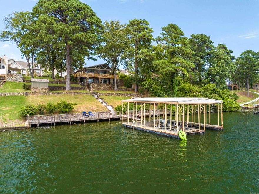 Welcome to this stunning 4-bedroom, 3-bathroom lakefront home on beautiful Lake Hamilton – a rare gem that combines the perfectbalance of luxury living, smart investment potential, and year-round lake enjoyment. Whether you're looking for a top-performing nightlyrental, a relaxing weekend getaway, or a full-time waterfront residence, this property delivers it all with style, comfort, and functionality.Recently renovated from top to bottom, this spacious home features a brand-new gourmet kitchen with custom cabinetry, sleekcountertops, updated appliances, and a modern open-concept design perfect for entertaining. The entire interior has been thoughtfullyupdated with new flooring, fresh paint, stylish lighting fixtures, and fully remodeled bathrooms that offer a spa-like experience. The mainliving area is light-filled and airy, with large picture windows showcasing breathtaking panoramic views of Lake Hamilton. The layout isideal for hosting family gatherings or accommodating guests, with four generously sized bedrooms, including a luxurious primary suitewith its own lake views and private bath. Step outside and experience the true highlight of this property – direct lake access with