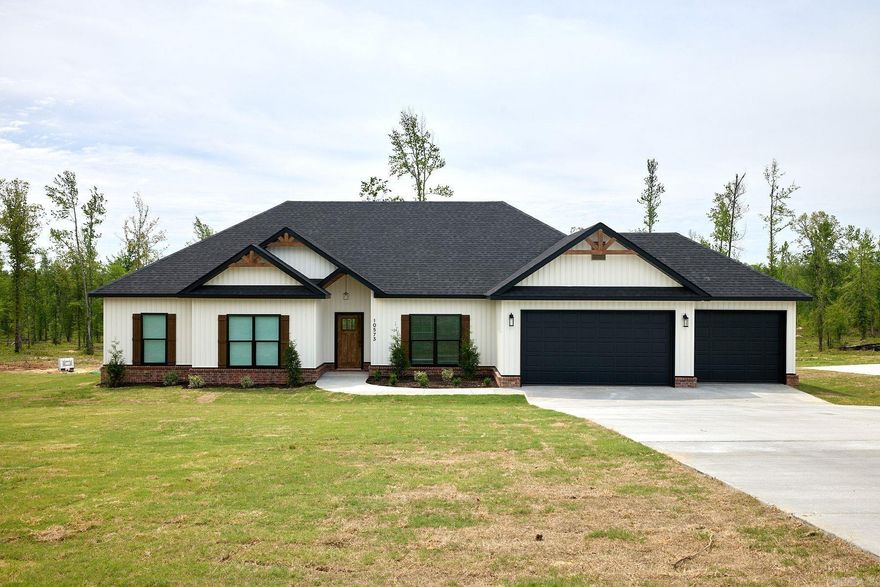 Discover the perfect blend of space, style, and tranquility in this stunning new construction home situated on a full 1-acre lot in Bauxite. With 2,200 square feet of thoughtfully designed living space, this 4-bedroom, 2-bath home shines with an inviting open-concept living area featuring an eye-catching coffered ceiling, adding architectural charm and an upscale feel. A cozy wood-burning fireplace anchors the main living space, making it ideal for both entertaining and relaxing nights at home. The kitchen is designed for function and flair, complete with ample workspace and a unique hidden pantry buyers will love. A dedicated laundry room adds everyday convenience, while the rare 3-car garage provides exceptional space for vehicles, storage, or hobbies. Surrounded by open land and built with modern comfort in mind, this home offers peaceful country living with the style and features today’s buyers are searching for.