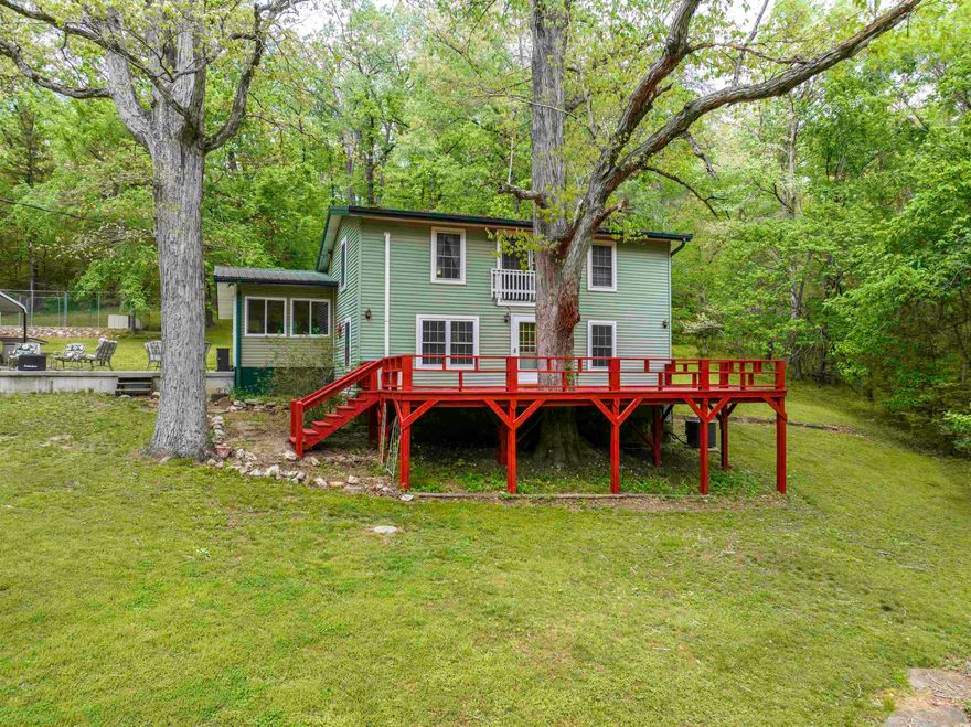 Country Home - Nestled on 5 beautiful ac with approx. 1,000 ft of Wells Creek, this well-maintained country home offers the kind of setting buyers are always hoping to find. The 1,680 sf home features 2 bed and 2.5 ba and is perfectly positioned above the creek, out of flood danger, so you can enjoy the water without the worry. Surrounded by large white oak trees that provide generous shade, the home has a welcoming large front deck where you can relax and take in the peaceful views. There is also a nice patio area, a 2-car metal carport, and several pecan trees that add even more charm to the property. The land is especially appealing, with a very gentle lawn that slopes down toward the creek, making access easy year-round. Whether you enjoy fishing, wildlife watching, or simply soaking up the quiet beauty of nature, this property delivers. Deer and turkey are frequent visitors, and the variety of birds, a true outdoor lover’s retreat. 36’ x 36’ barn adds excellent function and flexibility, whether you need storage, workshop space, or room for equipment and hobbies. A 36’ x 36’ barn adds function and flexibility. This is a rare opportunity to own a scenic creekside property.