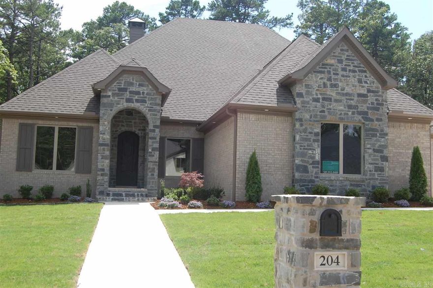 Beautiful home features 4 bedrooms, 4.5 baths, office, three car garage, back covered veranda with fireplace.  Kitchen features gas cooktop, double oven, wine/soda frig, microwave, under cabinet lighting & upper cabinet lighting. Gorgeous hardwood, beautiful tile, Custom wood work, custom master shower, eve lighting, sprinkler system, & zoysia grass.