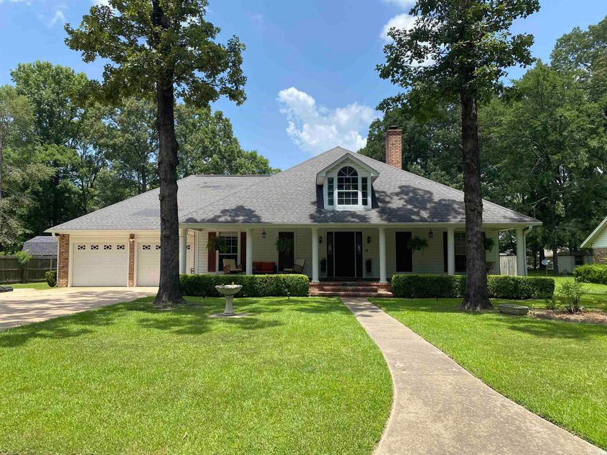 This spacious 3-bedroom, 2-bath home boasts 2,284 square feet of living space. As you step inside, you’ll find a cozy living room with a gas log fireplace, perfect for an evening of relaxation. The formal dining room provides an elegant space for gatherings.  The kitchen features a breakfast bar, dining area, gas range, and beautiful granite countertops. Custom cabinetry with lighting adds a touch of sophistication. Additionally, there’s a bonus room that could serve as a game room or office.  The split floor plan ensures privacy, and the master bathroom has been tastefully updated with a walk-in shower, his-and-her vanities, and dual walk-in closets. Step outside to the covered back deck, complete with a custom bar and propane fireplace—an ideal spot for entertaining.  The property also includes a 32x16 inground swimming pool for those hot summer days. A pool house with a covered porch, lighting, and ceiling fans provides a convenient retreat. Need extra storage? The shop with double roll-up doors has you covered.  Finally, enjoy the privacy of the fenced-in backyard. This home offers comfort, style, and plenty of amenities for a delightful living experience!