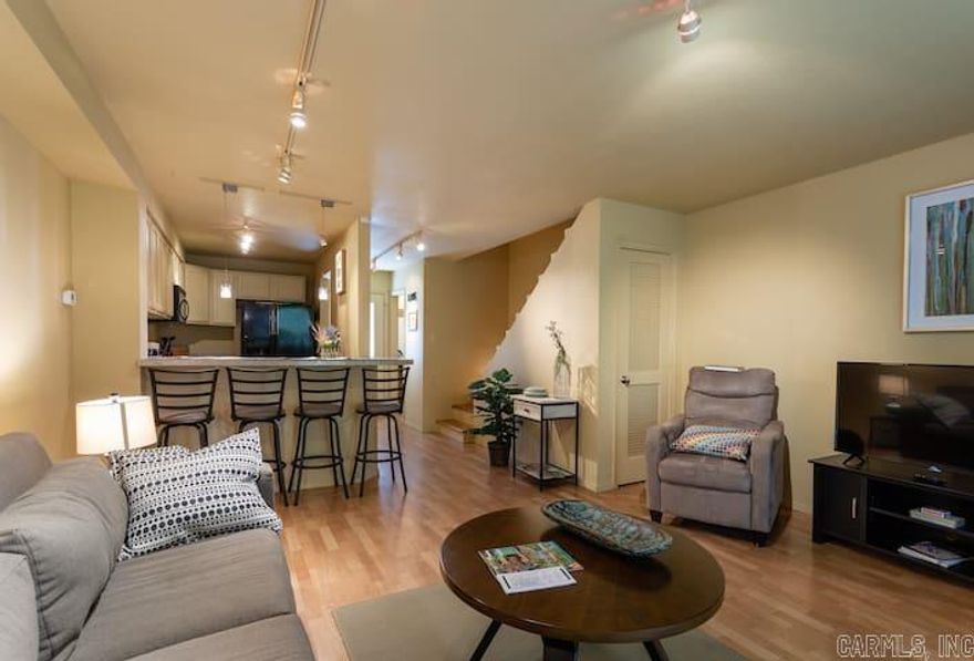 FABULOUS REMODEL on 2BR, 1.5 Ba condo just a stroll to the Cool Pool & Tennis/Pickle Ball Center!  A MUST SEE!!  The furnishings & decor items are beautiful, with everything included.  Updated kitchen with appliances included.  Updated bathrooms.  Washer/dryer in half bath.  Sleeps 6, using sleeper sofa.  Newer heatpump (2022).  Programmable thermostat too!  NEW Rear deck provides outside seating and dining.  Wood laminate, hardwood, & tile flooring. Start living the resort life & enjoy all of the Fairfield Bay Resort amenities.  Just a few steps from parking to front door entry!!!  Condo fee includes cable & internet!!!  This would be a very nice lake getaway for you, and also could be used as a popular short-term rental.  It's turnkey and ready to go! Shown by Appointment due to Airbnb guest schedule.  Call for details on Condo Assoc. Rules & Regs, Bylaws, fees ($128); also for the Fairfield Bay Resort & Community dues and service fees ($200), Bylaws.
