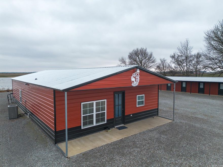 As the waterfowl season winds down, it is the perfect time to secure your lodging for next year. We are proud to offer "The MF Duck Club," an outstanding property situated in the premier waterfowl grounds between Bayou DeView and the Cache River.  The main lodge features three bedrooms and three bathrooms within a well-finished steel building. The living area boasts vaulted ceilings and ample space for trophies, creating a classic duck camp atmosphere. Designed for functionality, the lodge includes durable finished concrete floors, solid wood doors, and an eat-in kitchen fully equipped with stainless steel appliances and a large eight-seat table. The layout is highlighted by two private master suites and a comfortable guest room.  The outdoor living space is ideal for relaxing after a day in the field. The screened-in back porch features a BBQ grill, television, and a pellet fireplace, offering a perfect spot to watch the waterfowl settle into their roosting areas.  In 2023, the owners added a motel-style living area to accommodate members and guests. This structure includes eight private bedrooms—each with a twin bunk bed, kitchenette, and individual climate control.