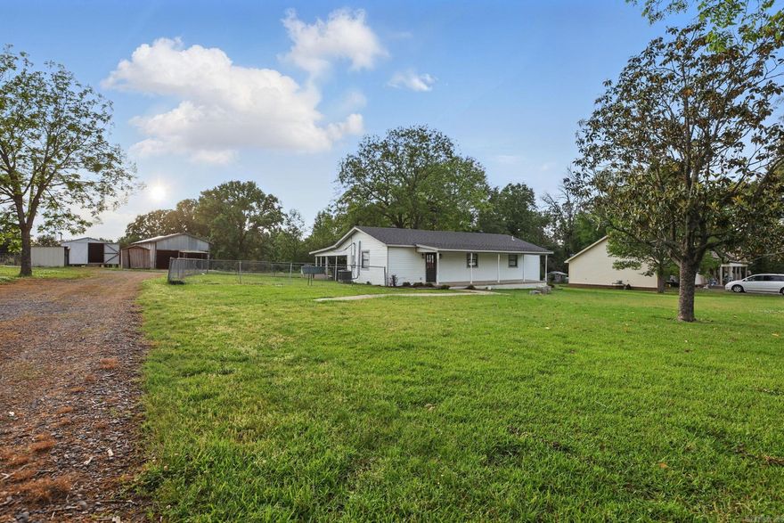 Explore this beautifully remodeled country home located in Lonoke County, set on 2.40 acres. The spacious covered front porch greets you and your guests, inviting you into this updated residence featuring a new roof, central heating and cooling, a new water heater, and much more inside. The kitchen boasts new cabinets, countertops, and appliances, seamlessly connecting to the great room, which leads to a covered back porch and a carport. Additionally, there is a lovely shop and three storage buildings. With ample space on the 2.4 acres, there’s plenty of room for a small farm or a large garden. Plumbing and electrical systems have been upgraded, and both bathrooms have been refreshed. This property qualifies for the Rural Development Loan, allowing you to purchase with no money down. A survey is included in the associated documents. The age listed is the effective age from the tax records.
