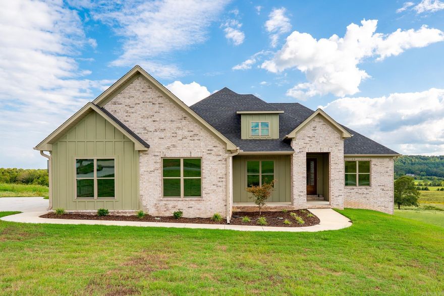 Beautiful custom-built new construction 4 bed/2 1/2 bath Greenbrier home sits on almost an acre in Reynolds Ridge! Wonderful open floor plan with large living room and beautifully designed kitchen with custom cabinetry, quartz countertops, stainless steel appliances, center island, walk-in pantry & separate dining area. The primary suite features double sinks w/split vanities, soaker tub w/tile surround, tiled walk-in shower, & walk-in closet w/access to the laundry room. The guestrooms are all a great size & share a wonderful hall bath w/double sinks & tub/shower w/tile surround. The mudroom has built-in w/coat hooks, bench seating & cabinet/cubby storage. The exterior features nice landscaping, a gorgeous back deck, 2 car garage & huge lot. Seller concessions of $10,000 towards buyers closing costs or rate buy down.
