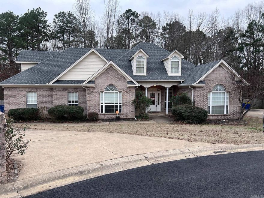 This beautiful 4 BR 3 BA home is located in a secluded cul-de-sac in Greystone. Features high ceilings and trey ceilings. So many improvements including a new roof in 2024, new flooring in most rooms. New hot water heater. Spacious Kitchen features double oven, granite countertops, tile backsplash and breakfast bar. Living Rm has wood burning FP. Upstairs features a 2nd primary BR with personal full bath. Plenty of storage in the floored attic. Lots of beautiful crown molding. The back yard has a large deck and the yard backs up to a tranquil wooded green space. There is a certified storm shelter in the large 2 car garage. Priced to sell. Don't miss this great opportunity to make this house your new home.