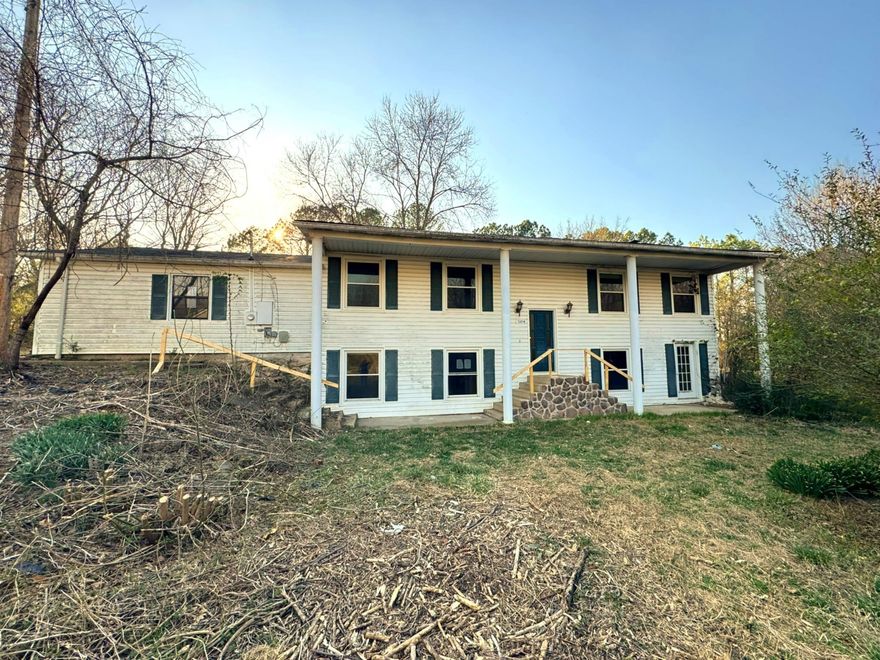 This stylish White Colonial 3 Bedroom/ 1 bath. Home sitting on a 1 ac/ml lot. Located in the Flippin City limits, features a large back yard the overlooks the Flippin Ball Park. Large Mature Trees, a Storage Shed, and a nice sized Covered Deck. Inside you will find a well-designed Kitchen, a large Livingroom & 2 bedrooms on the main floor. The Full Finished Basement features and additional Bedroom and a Family Room with a walk out door to the front yard, plus a space set up to for a wood burning stove.